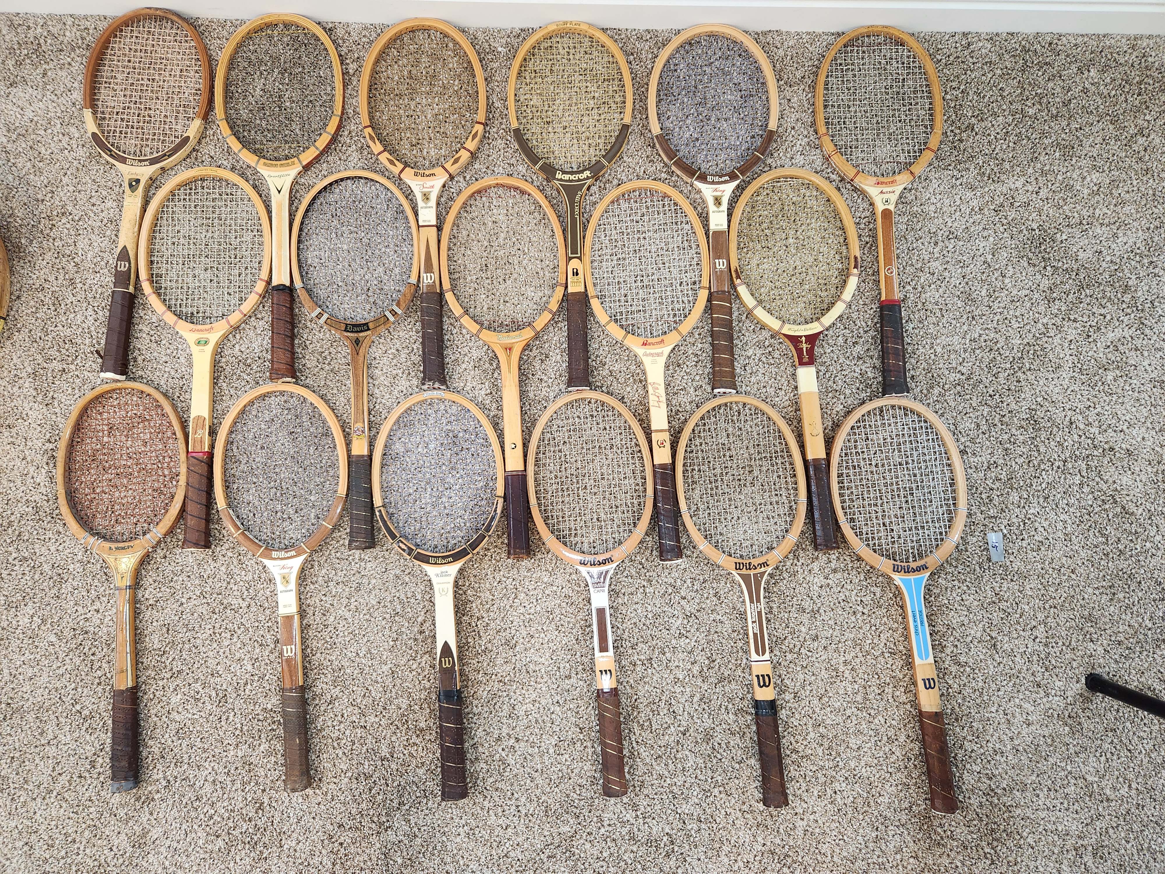 Vintage wood tennis rackets for sale — group inventory shot of 18 pieces
