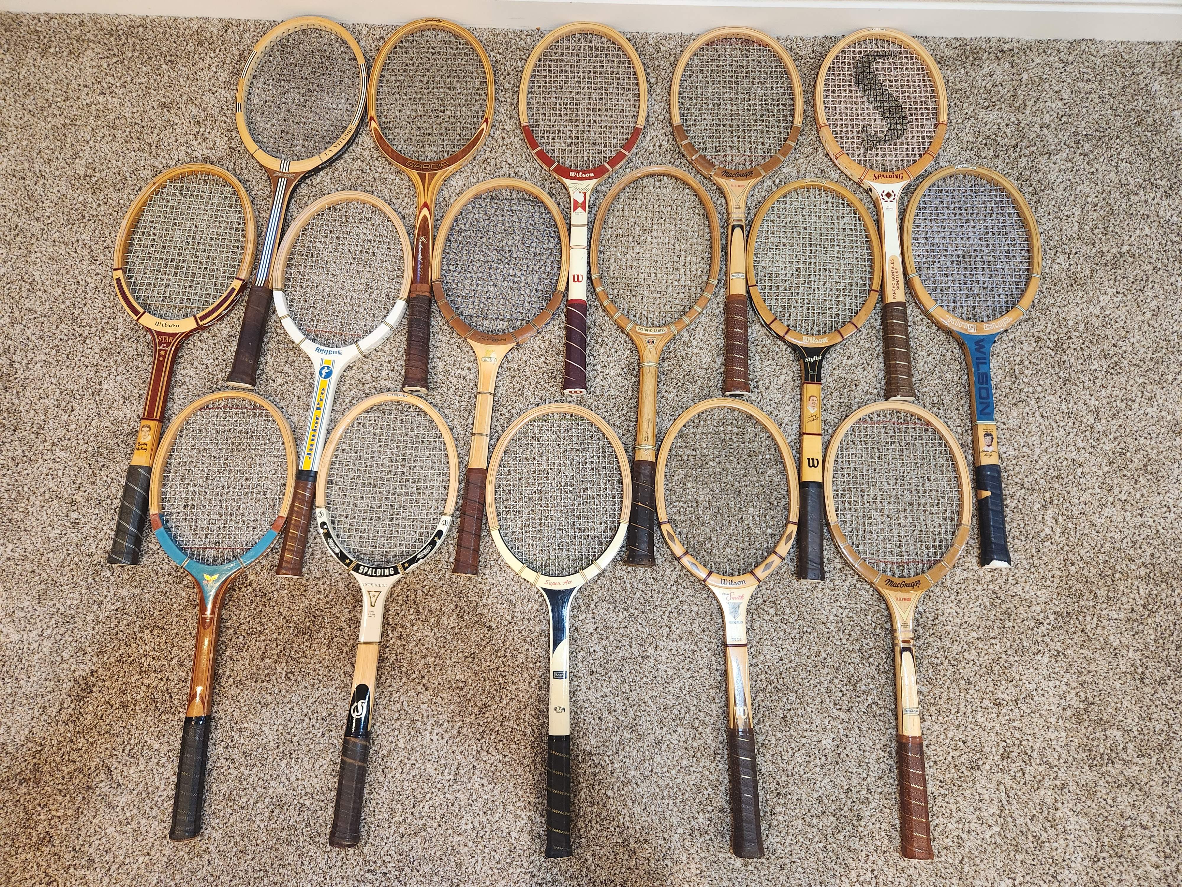 Vintage wood tennis rackets for sale — group inventory shot with Wilson, Spalding, MacGregor